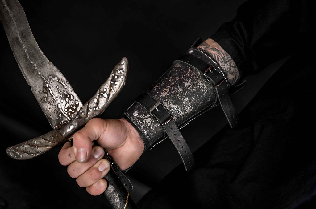 Medieval leather bracers with hand protection